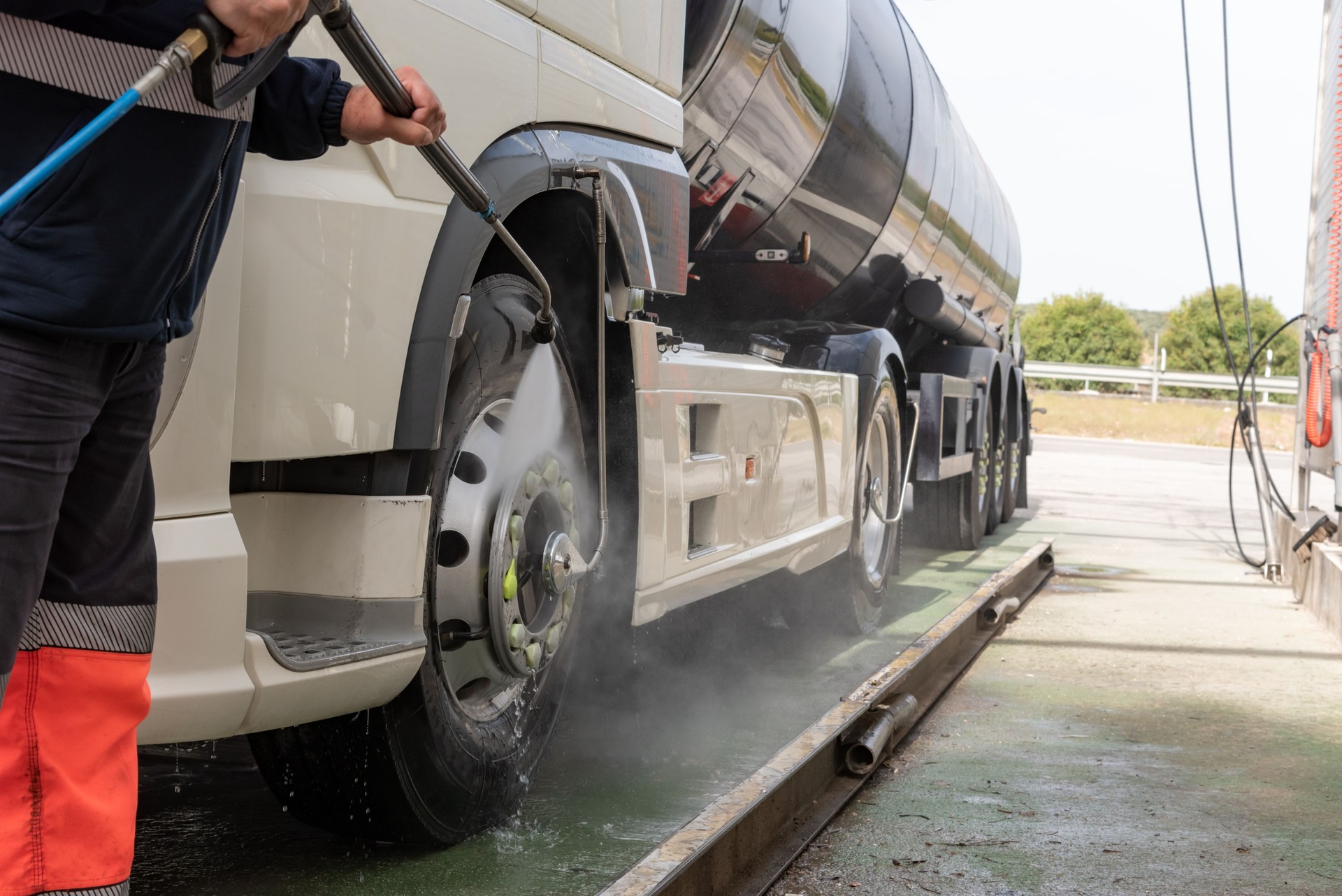 Cleaning the truck with pressurized water